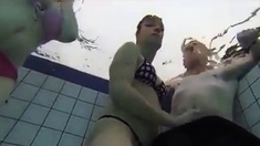 Teen Gives Handjob In Public Pool