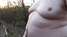 Chubby masturbates in the woods