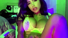 Busty babe playing with her big boobs